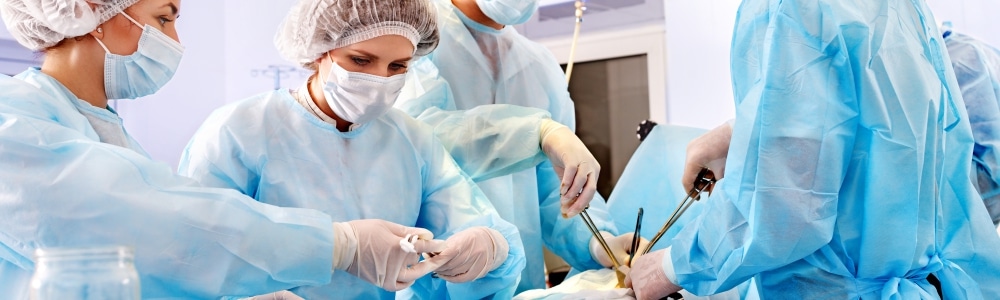 Doctors operating on a patient in surgery